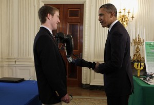 easton and president obama shaking hands with robotic arm